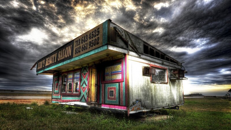 abandoned beauty salon under stormy sky