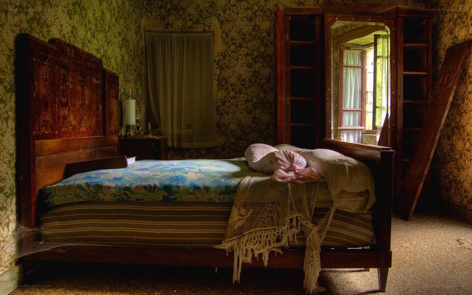 abandoned bedroom with floral bedspread