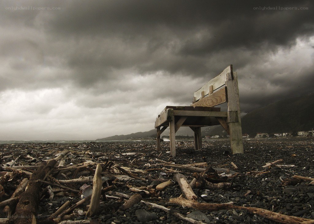 Abandoned bench on a stormy beach