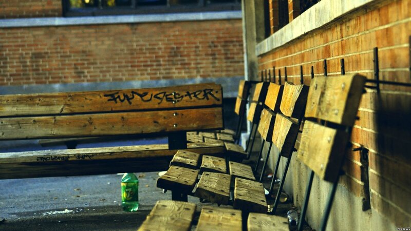 Abandoned benches in alley