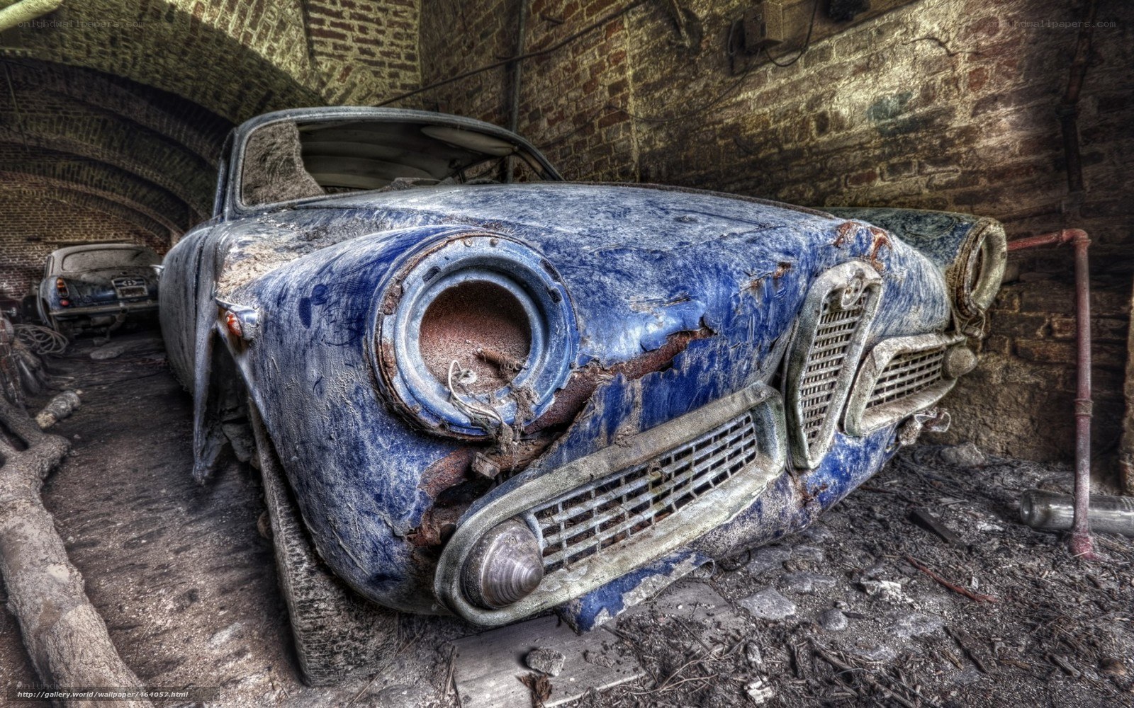 Abandoned blue car in tunnel