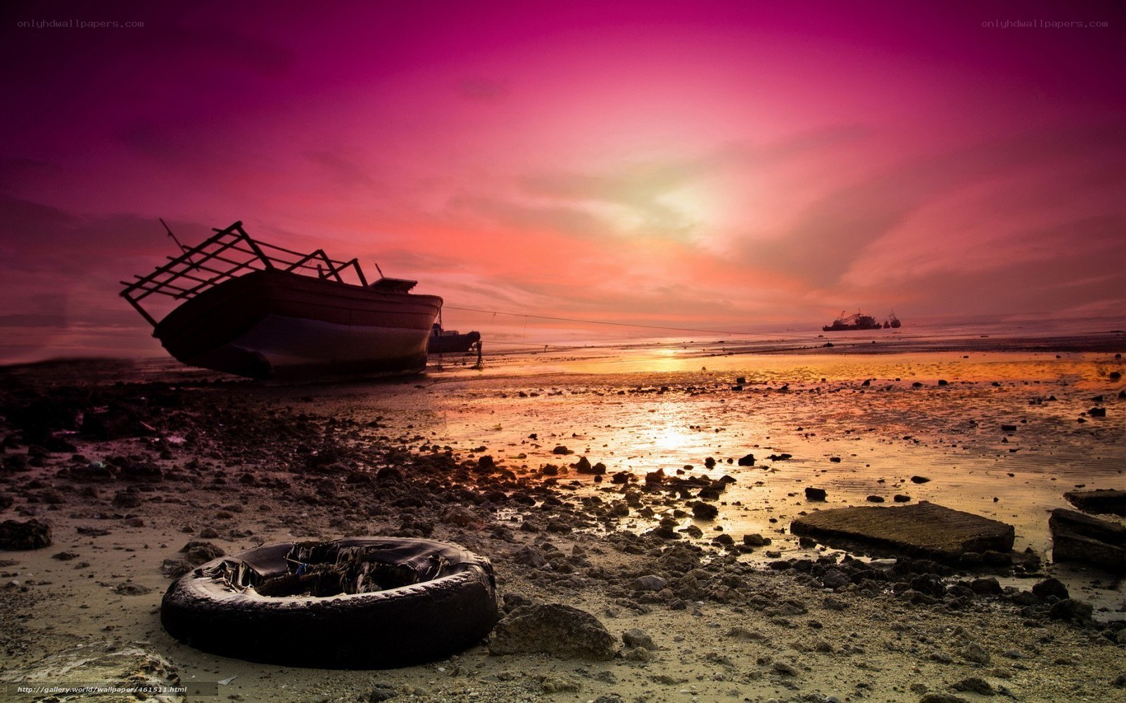 Abandoned boat at sunset