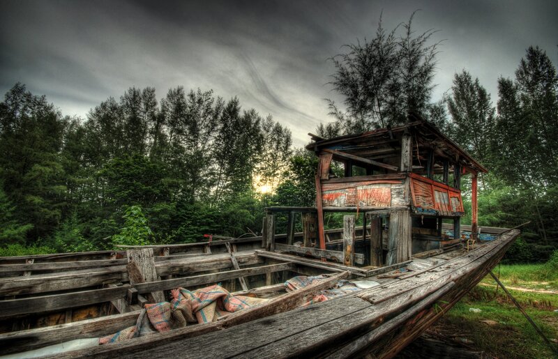 Abandoned boat in forest