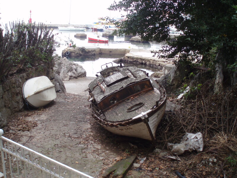Abandoned boat in harbor