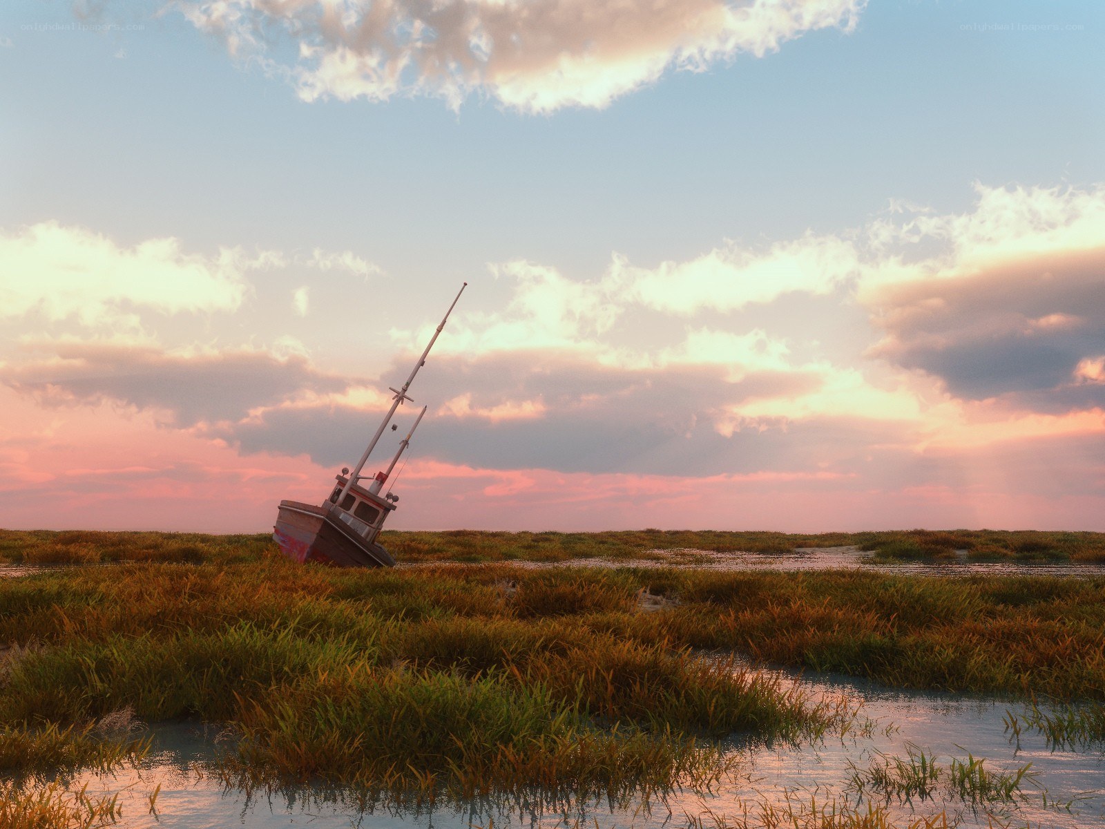 Abandoned boat in marsh at sunset