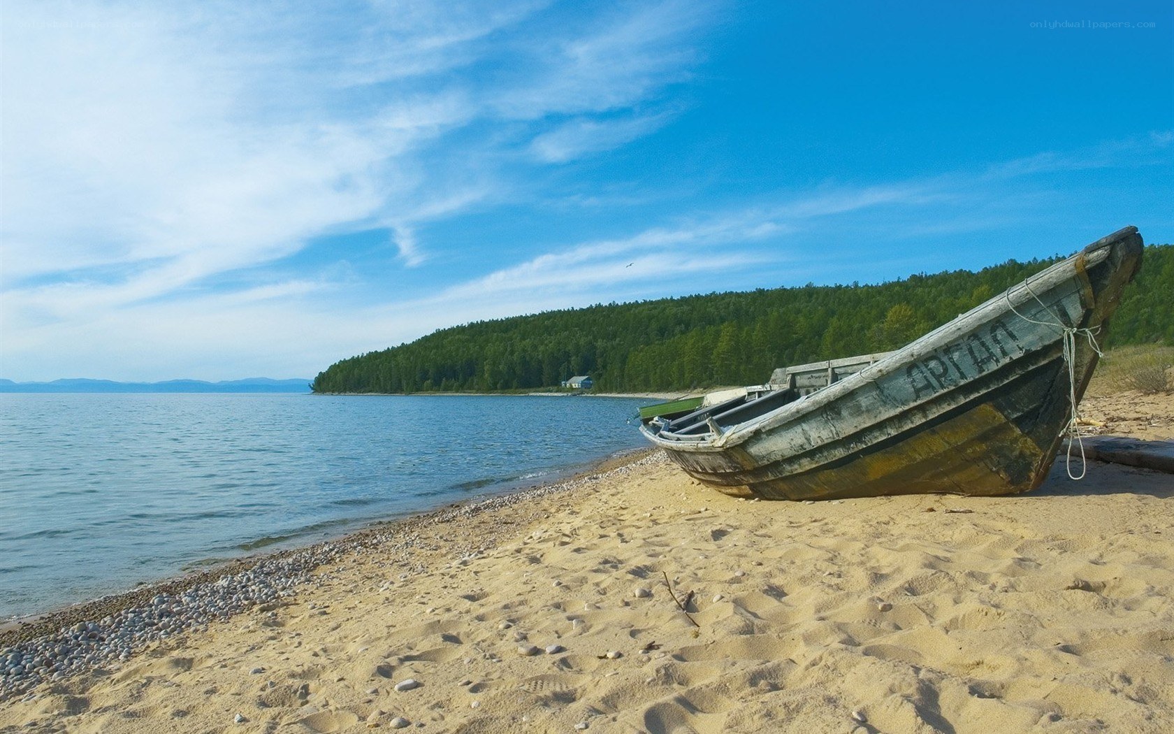 Abandoned boat on a sandy shore