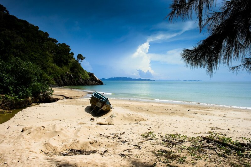 Abandoned Boat on Beach — Blue, Serene, Afternoon, Photograph, Ocean, Trees