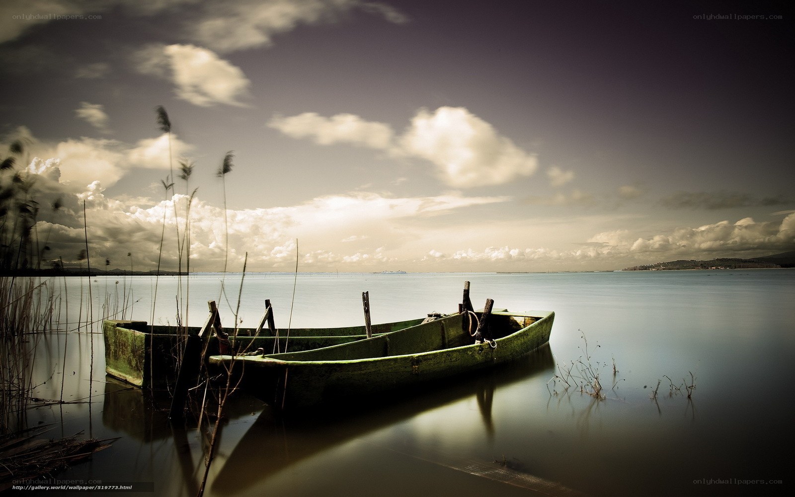 Abandoned boat on calm lake