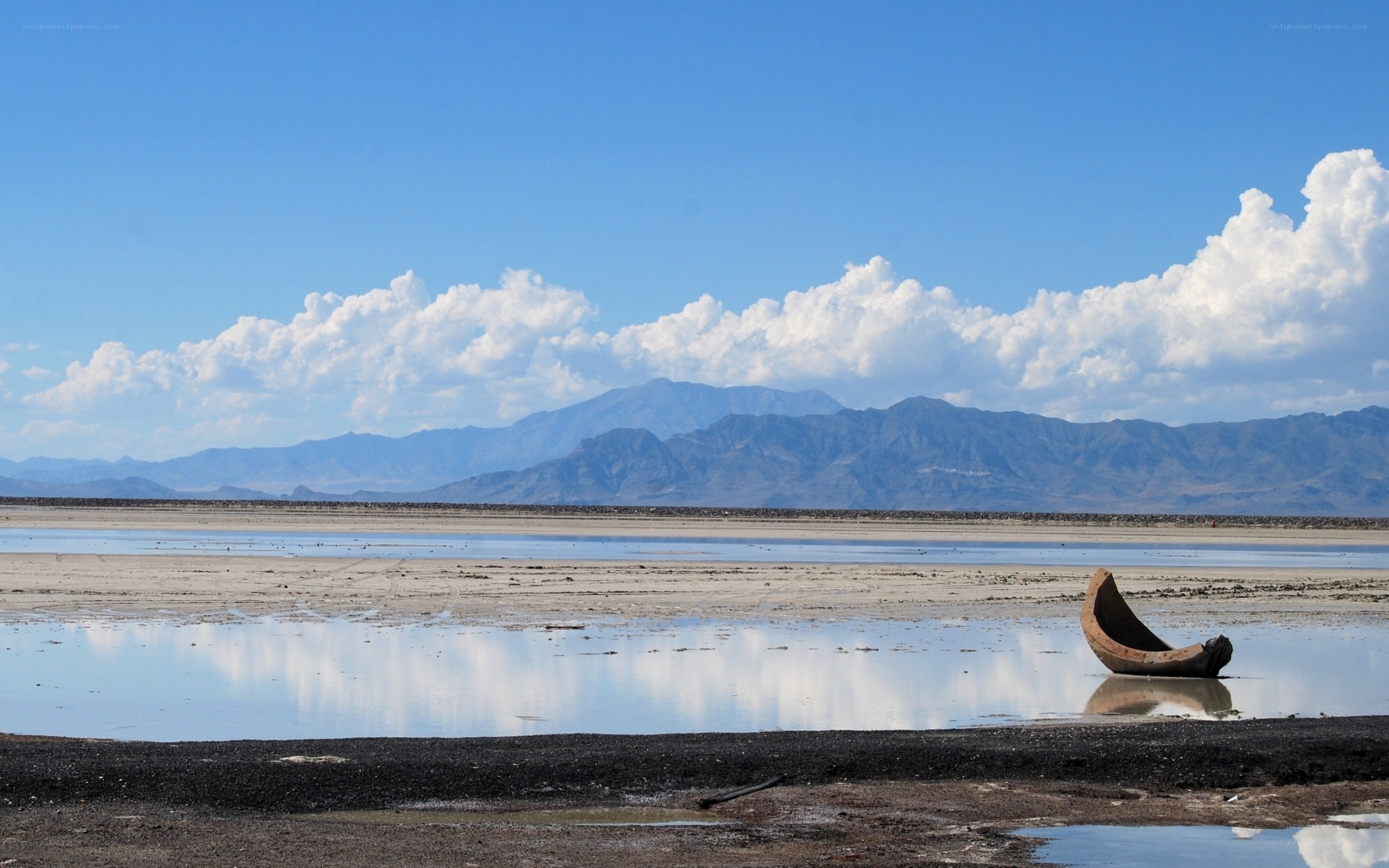 Abandoned boat on dry lakebed