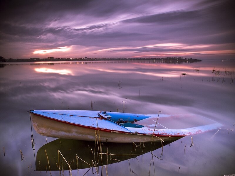 Abandoned Boat on Lake
