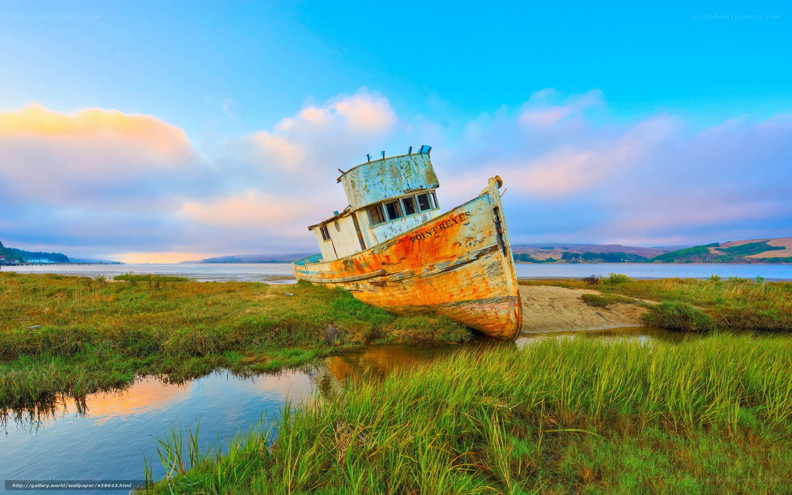 Abandoned boat on marshland