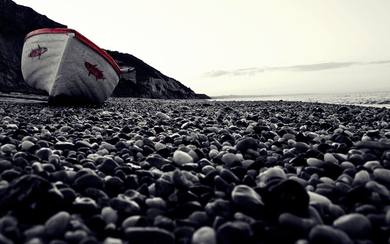 Abandoned Boat on Pebble Beach — Black