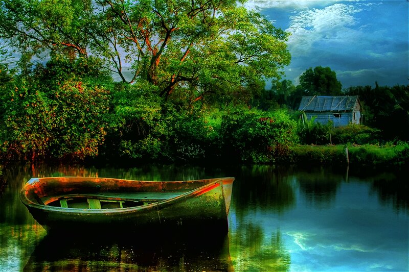 Abandoned Boat on River