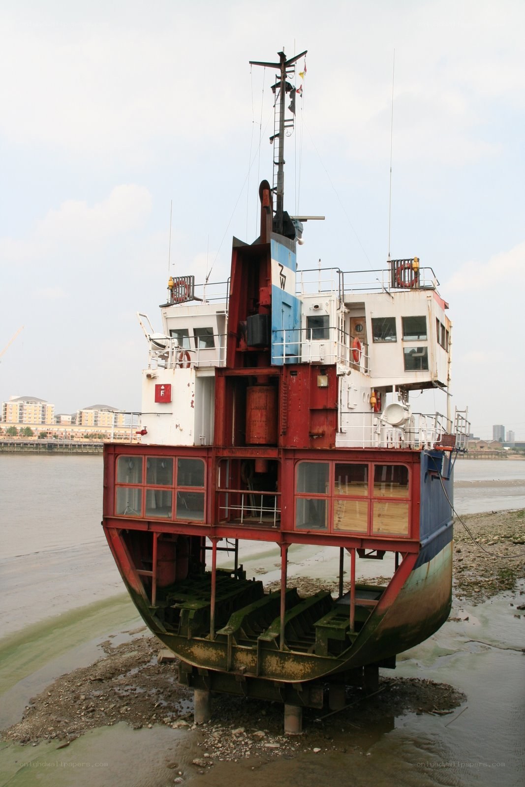 abandoned boat on riverbank