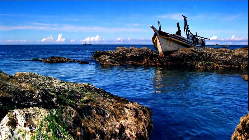 Abandoned Boat on Rocks