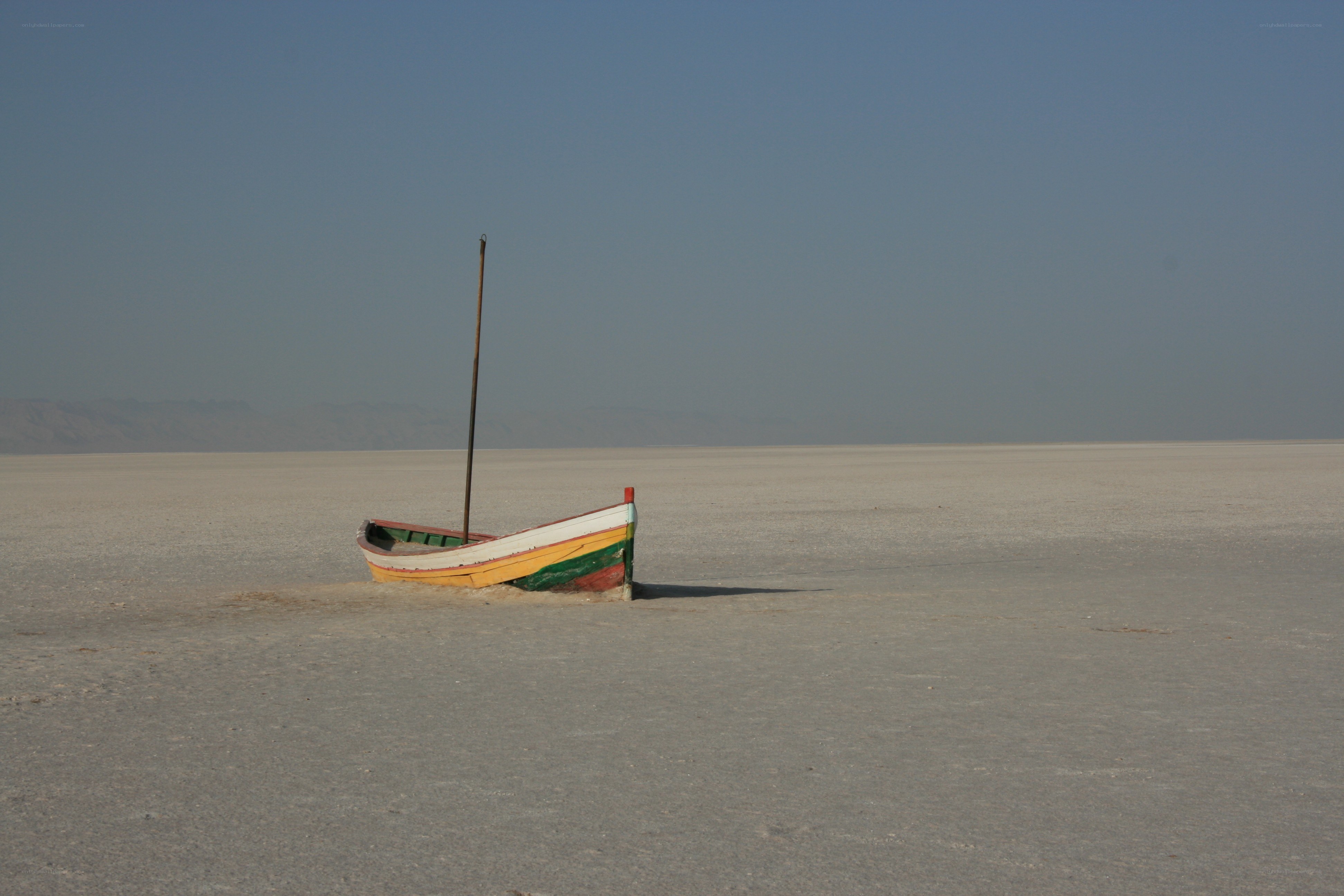 Abandoned boat on salt flat