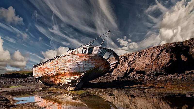 Abandoned Boat on Shore — Blue, Dramatic