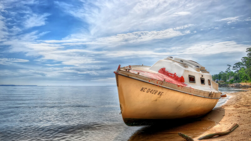 Abandoned Boat on Shore — Blue, Serene, Afternoon, Photograph, Sand