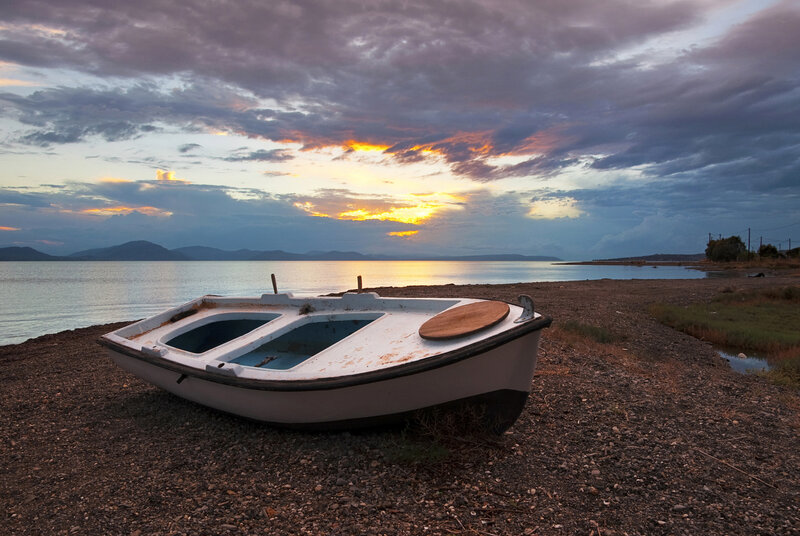 Abandoned Boat on Shore — Blue, Serene, Sunset, Photograph, Sea