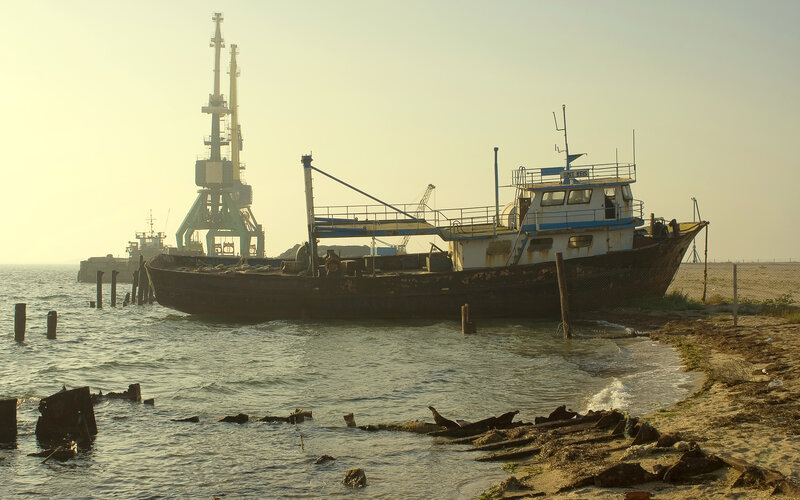 Abandoned Boat on Shore — Brown