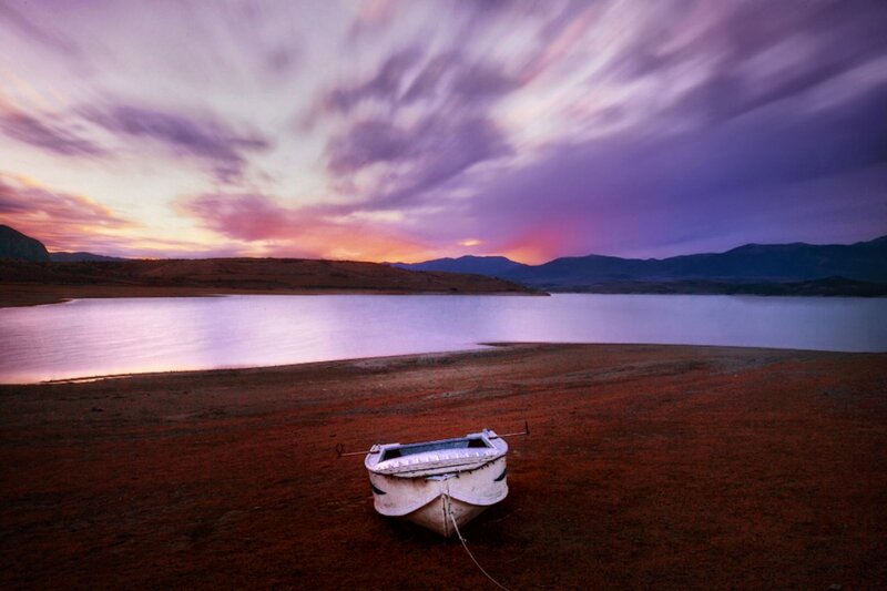 Abandoned Boat on Shore — Purple