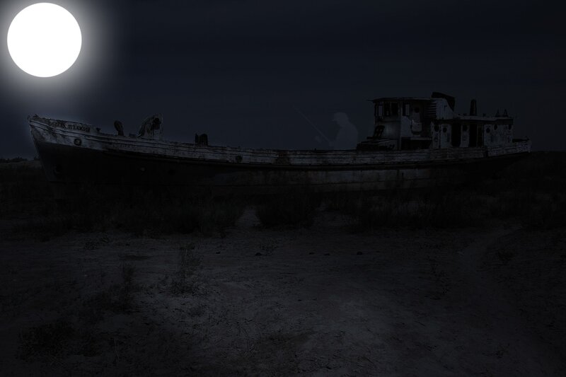 Abandoned boat under moonlight