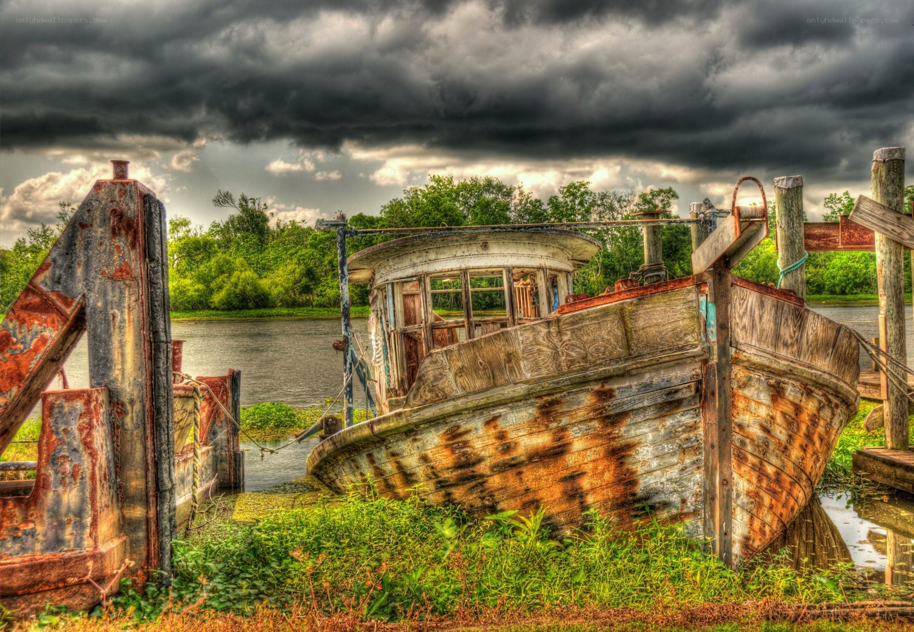 Abandoned boat under stormy sky