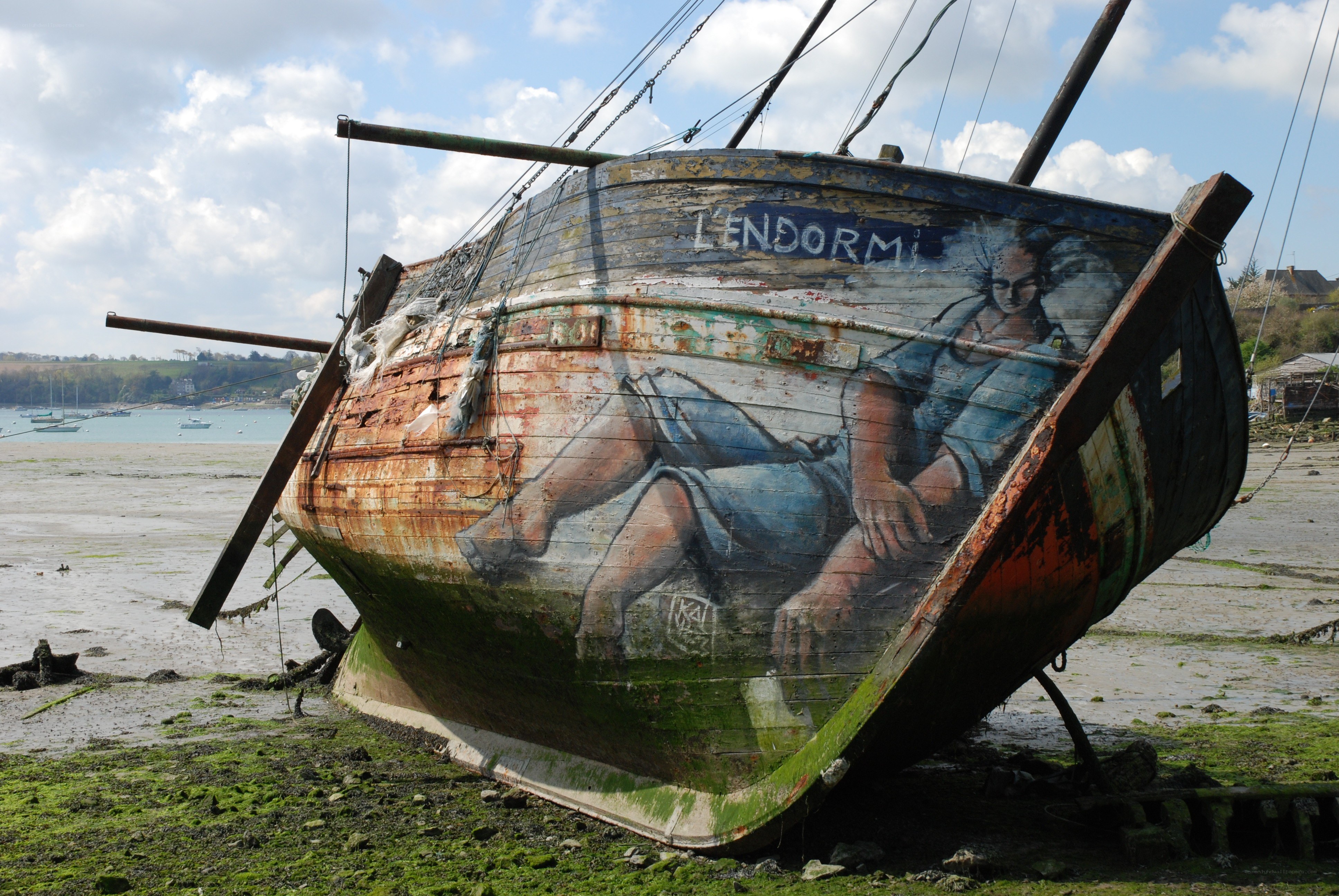 Abandoned boat with mural