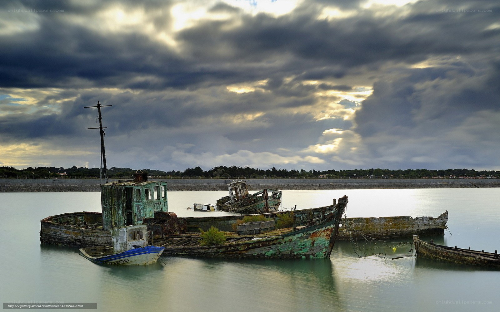 Abandoned boats in calm water