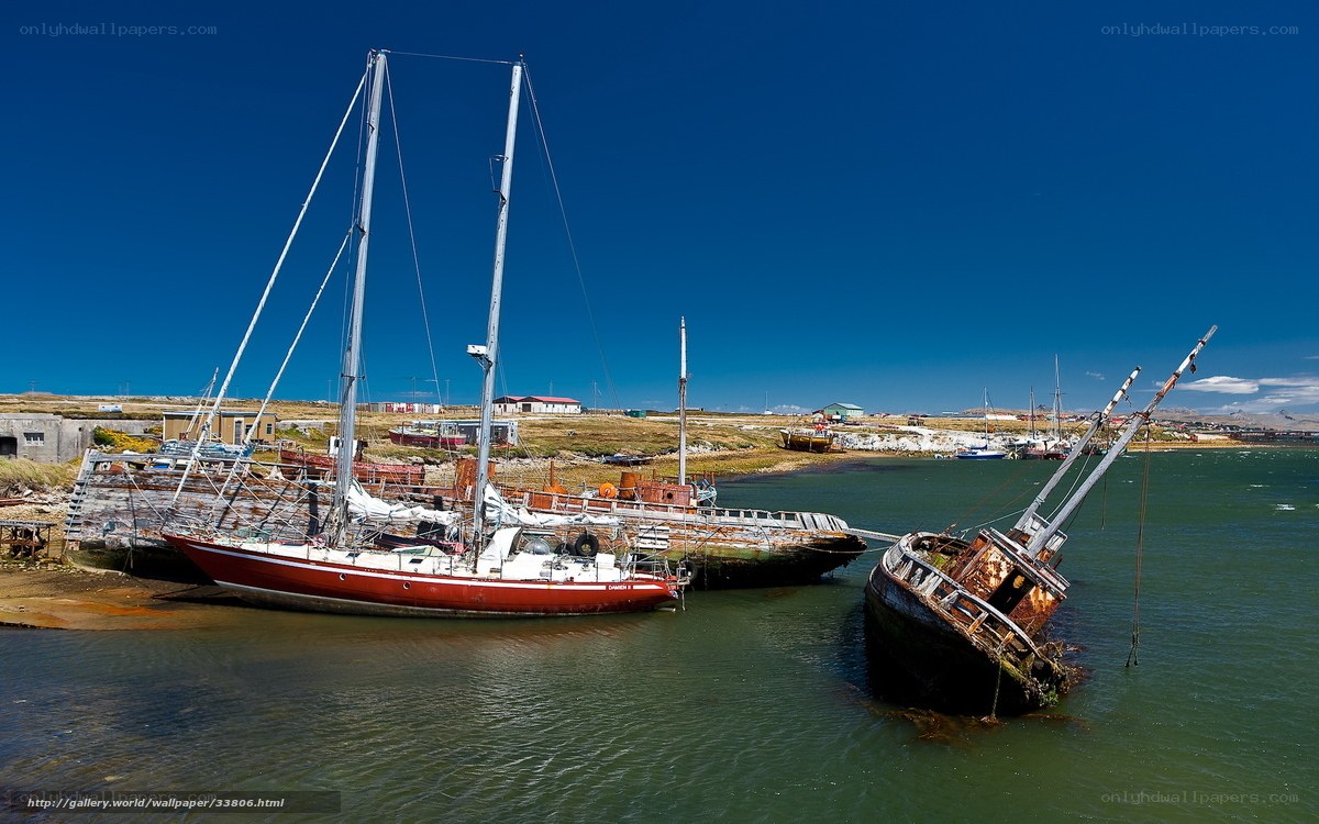Abandoned boats in harbor