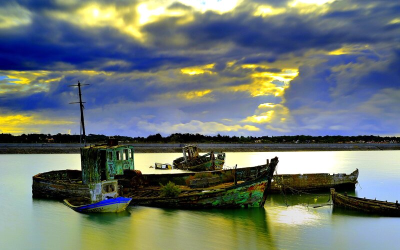 Abandoned Boats in Water