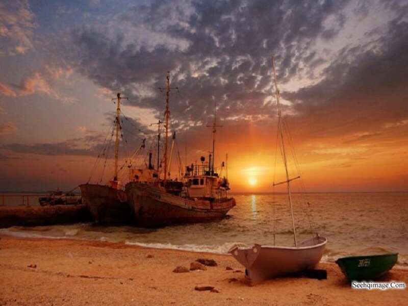 Abandoned Boats on Beach — Orange