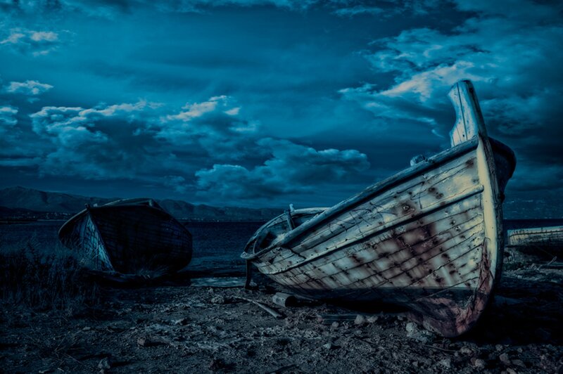 Abandoned Boats on Shore — Blue, Dramatic