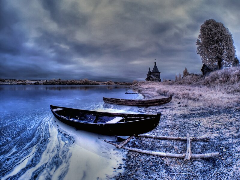 Abandoned Boats on Shore — Blue