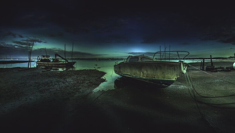 Abandoned Boats on Shore — Dark Blue