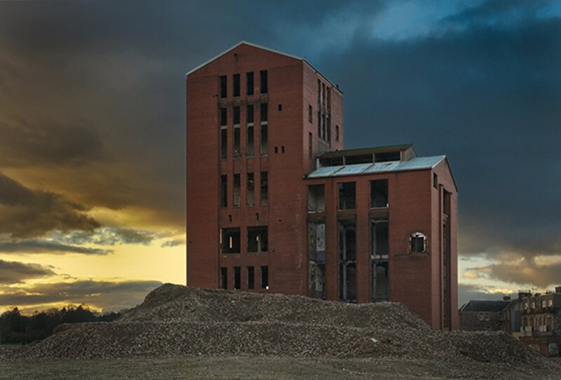 Abandoned brick building at dusk