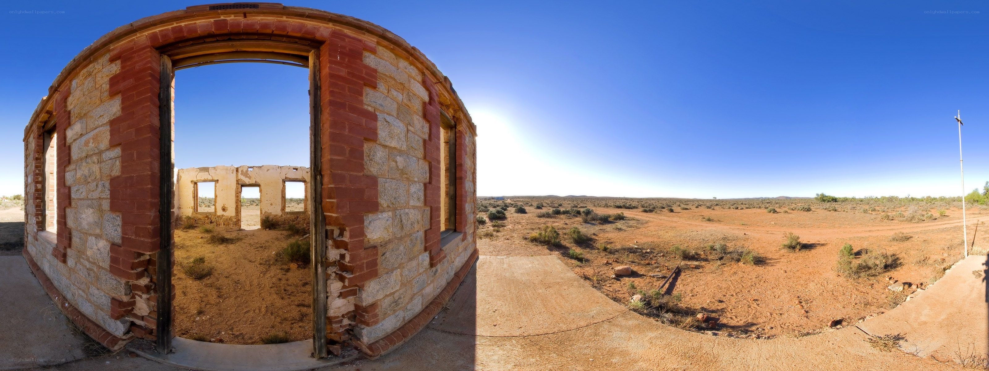 Abandoned brick building in desert