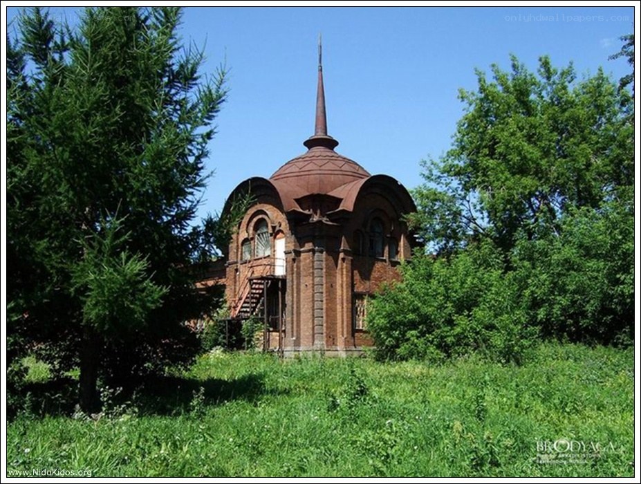 abandoned brick building with spire