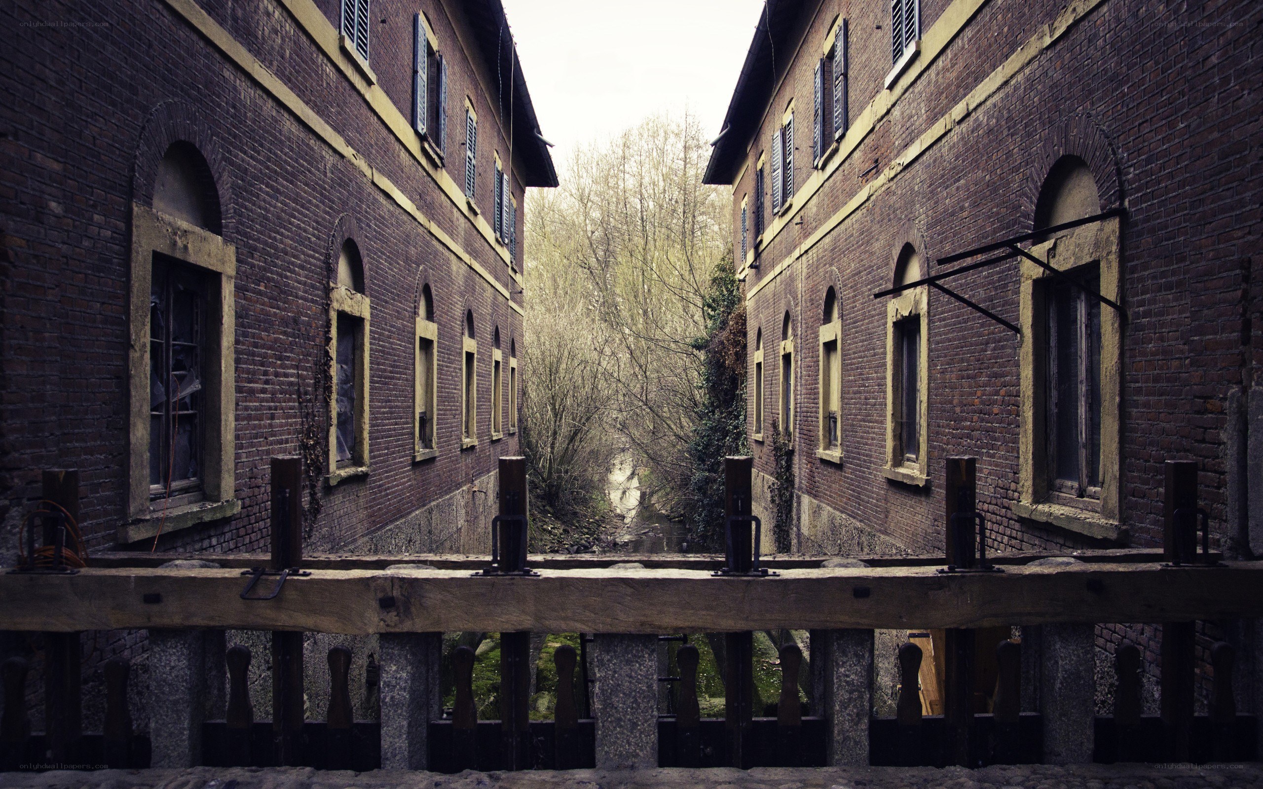 abandoned brick buildings by canal