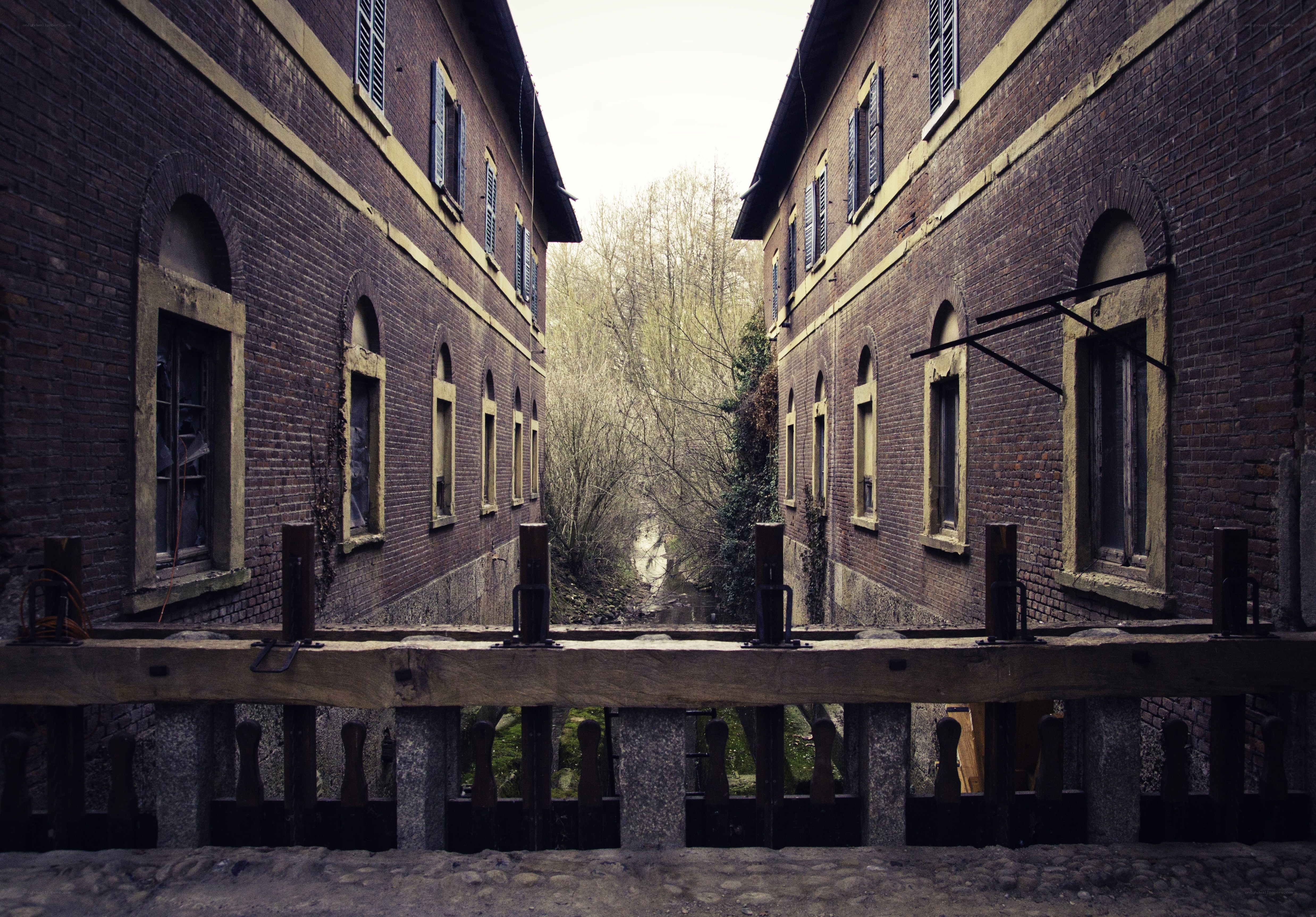 abandoned brick buildings by river