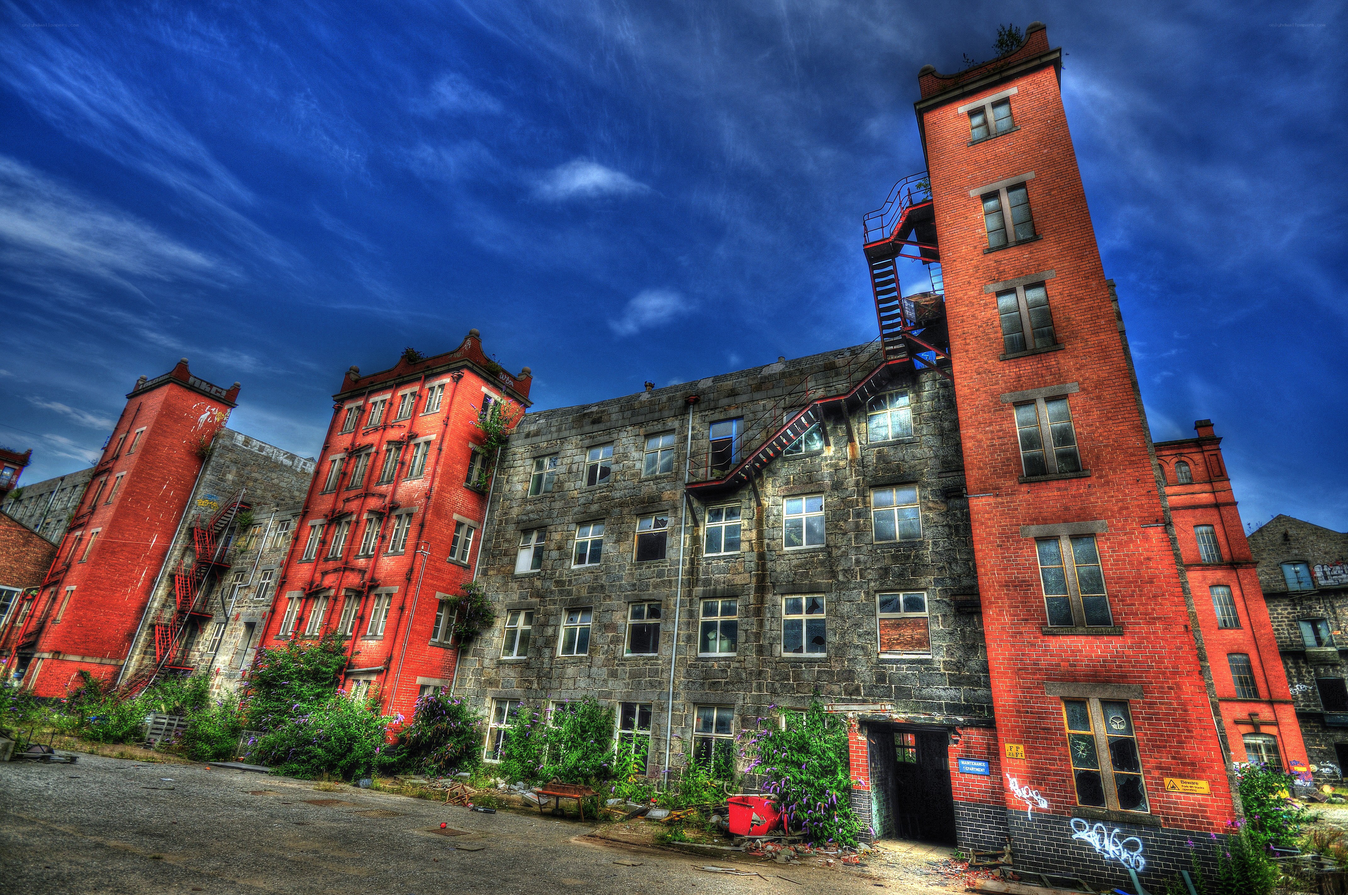 Abandoned brick buildings under blue sky