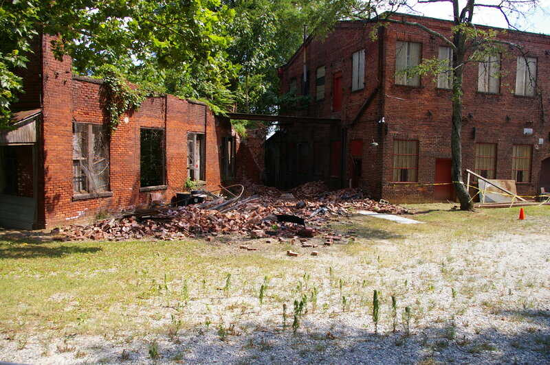Abandoned brick buildings with debris