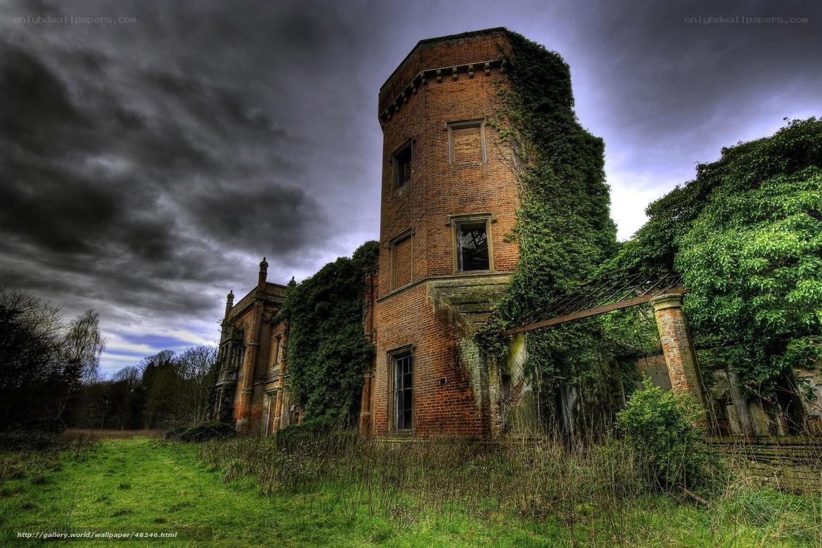 Abandoned brick tower in overgrown landscape