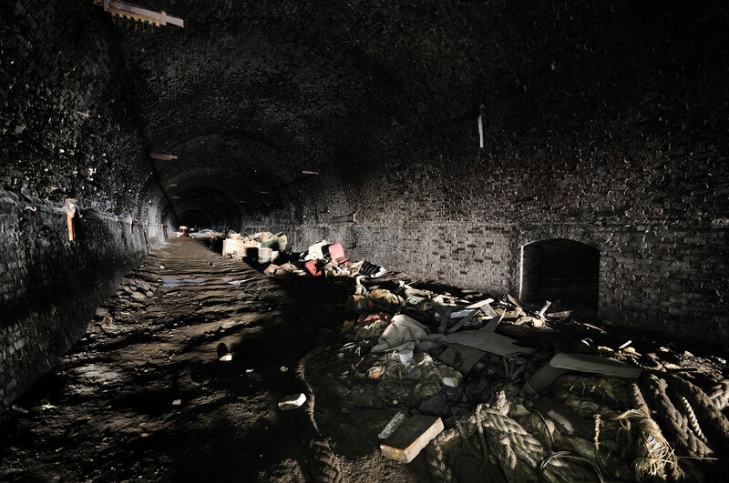 Abandoned brick tunnel interior