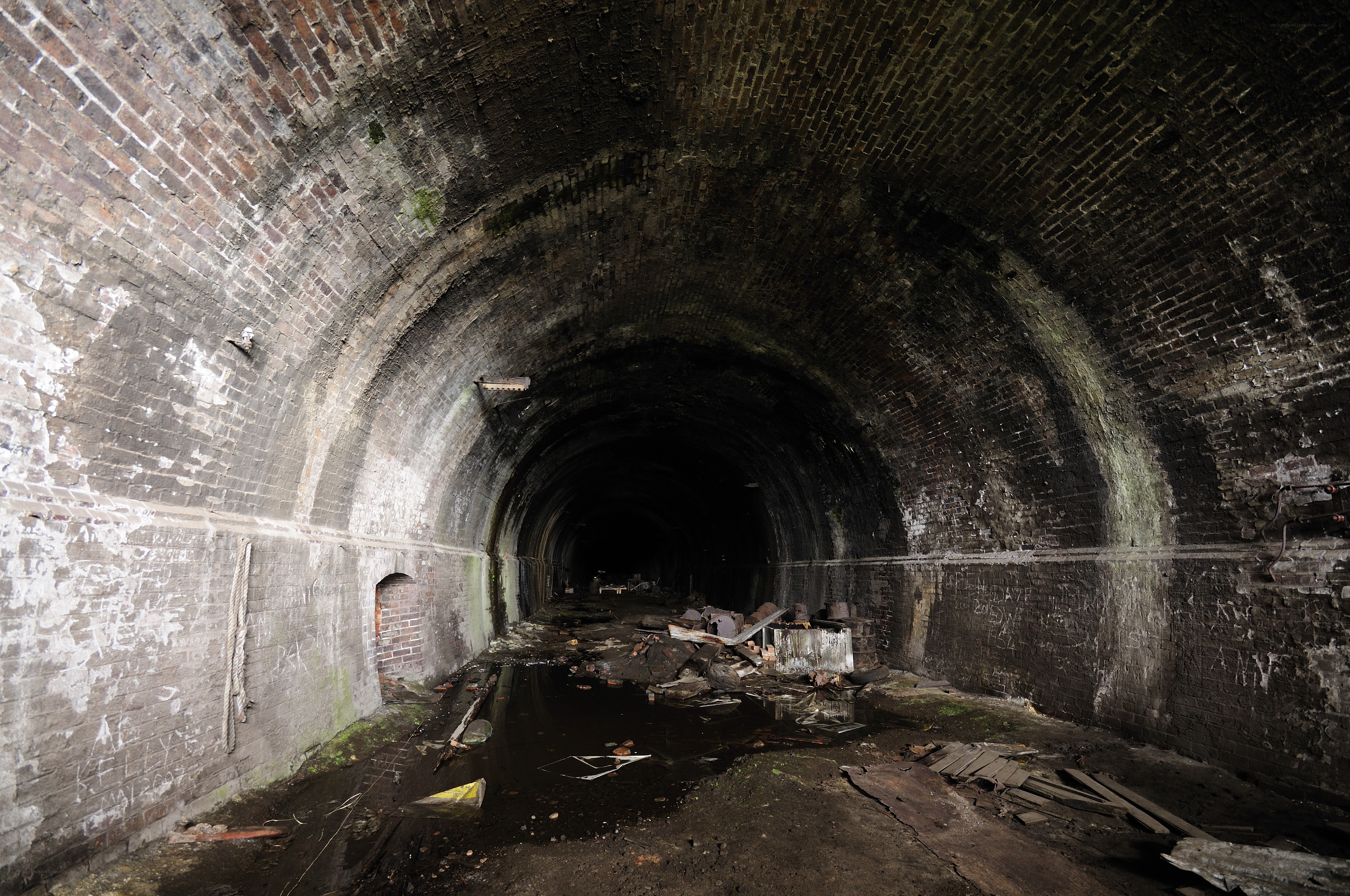 Abandoned brick tunnel interior