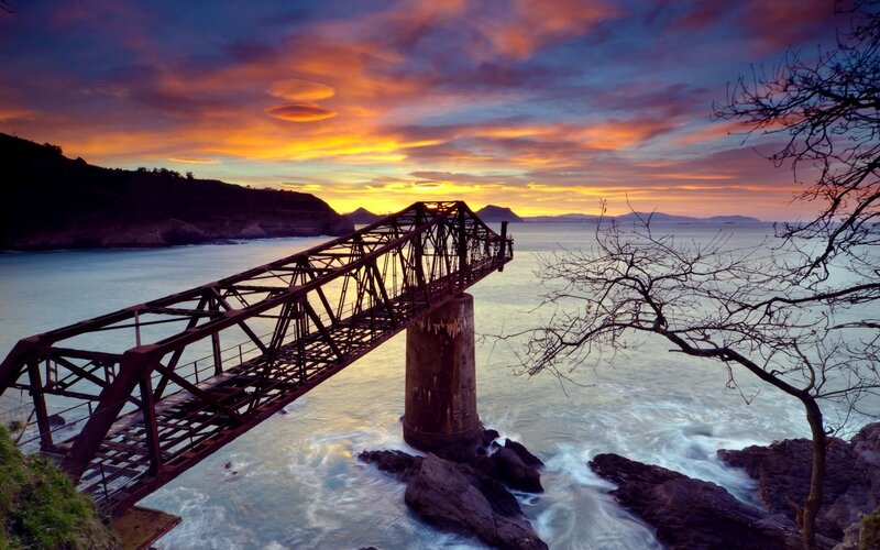Abandoned Bridge at Sunset — Orange, Dramatic