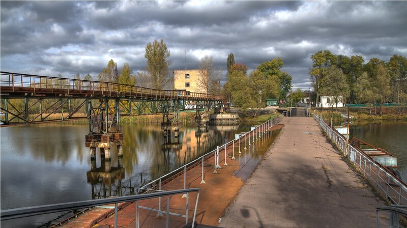 Abandoned Bridge over River — Gray