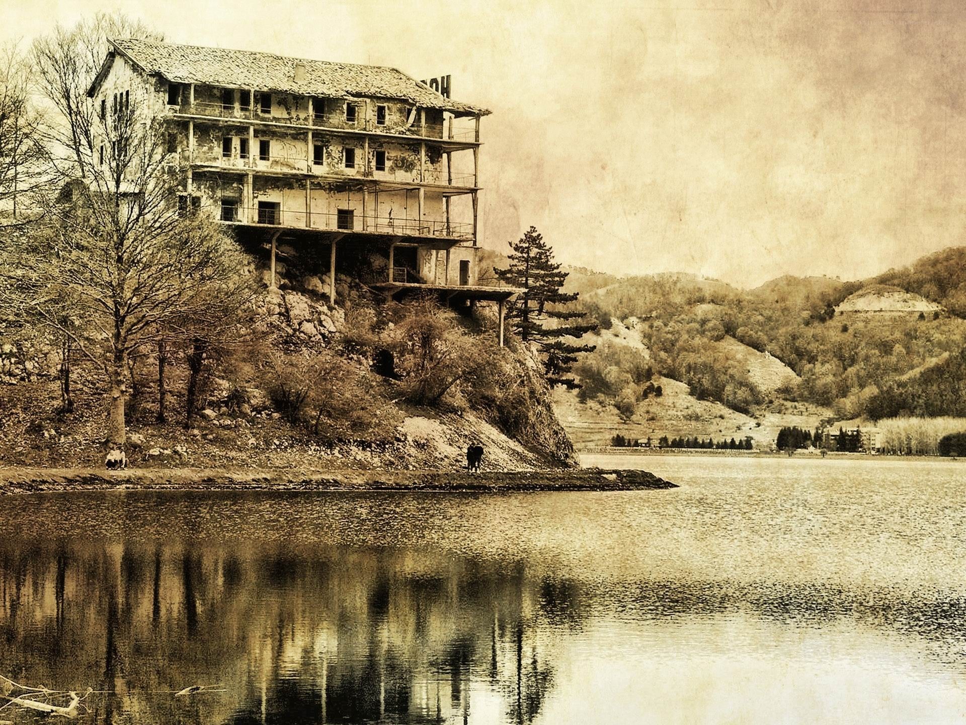 Abandoned building by a lake