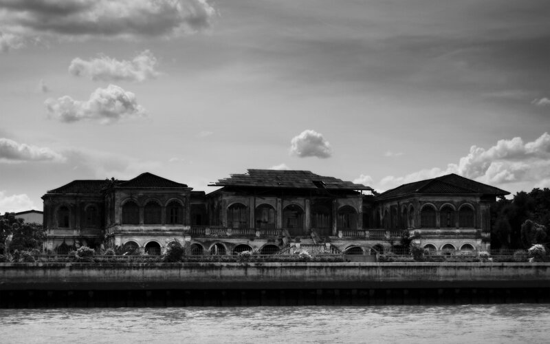Abandoned Building by River — Black