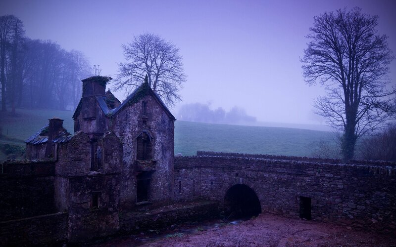 Abandoned building in foggy landscape